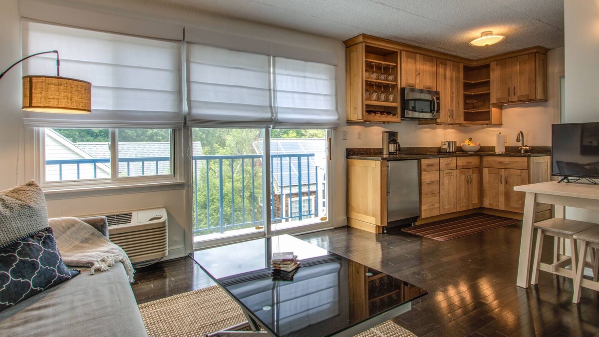 The Pines Condo | Modern in-town condo with parking on Rehoboth Ave and linens now included!