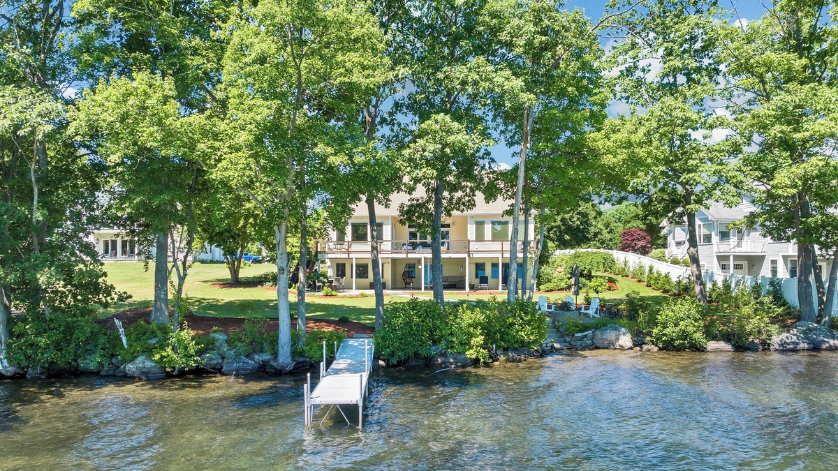Laconia House | Modern Lake Opechee Home features Sandy Perched Beach and Dock