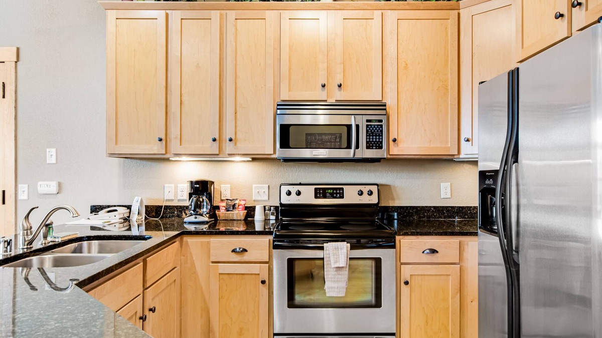 Three Lakes Condo | Modern, lake-view condo with loft, balcony, fireplace, pool & hot tub access