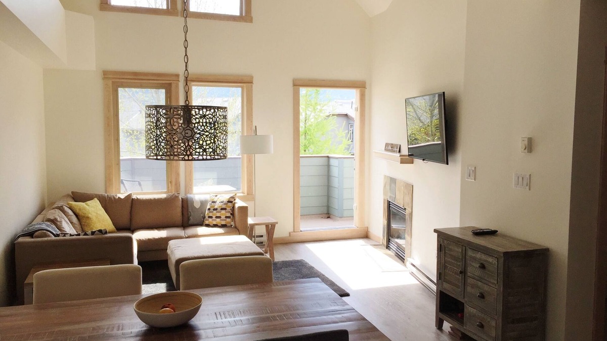 Canmore Condo | Modern, rustic mountain view loft style condo with pool, hot tubs & XL beds.