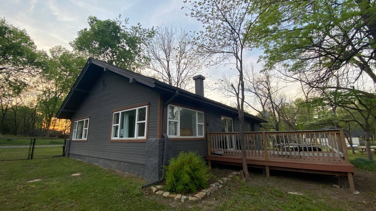 Afton House | Monkey Island Escape sleeps 8, surrounded by nature with views of Grand Lake.