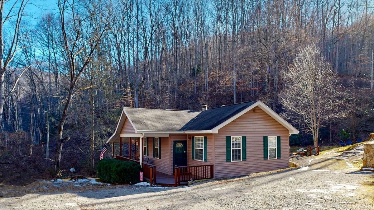 Sylva House | Mountain view home with a fireplace with beautiful view of the creek
