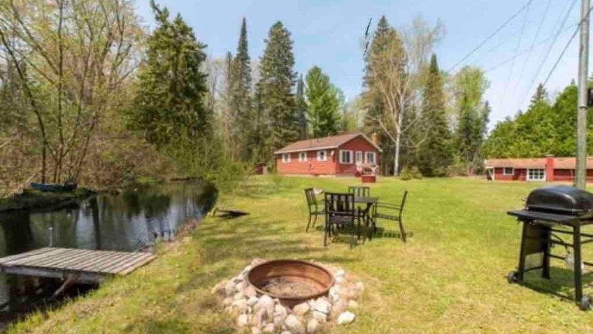 Cheboygan Cabin | Mud Creek Cottage waterfront acre lot & game-room