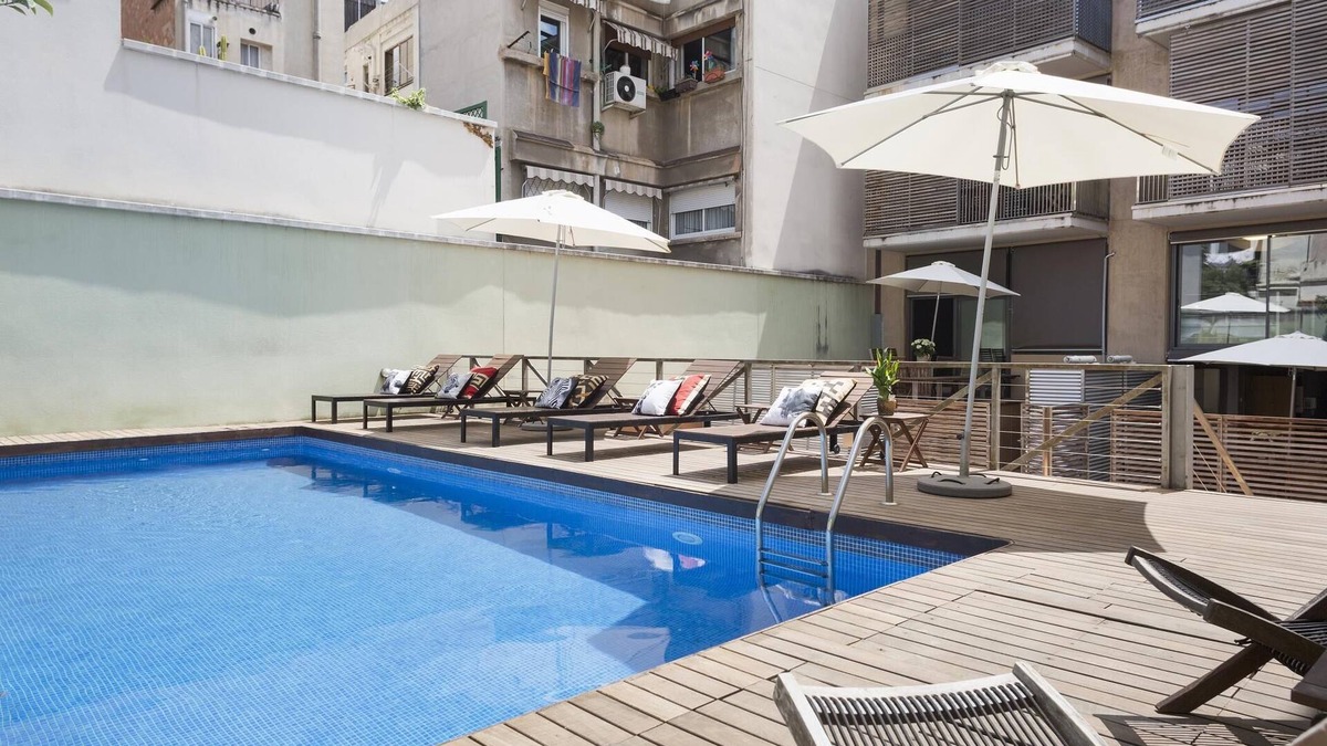 la Vila de Gracia Apartment | My Space Barcelona Apart. in a building with a shared swimming pool in Gracia