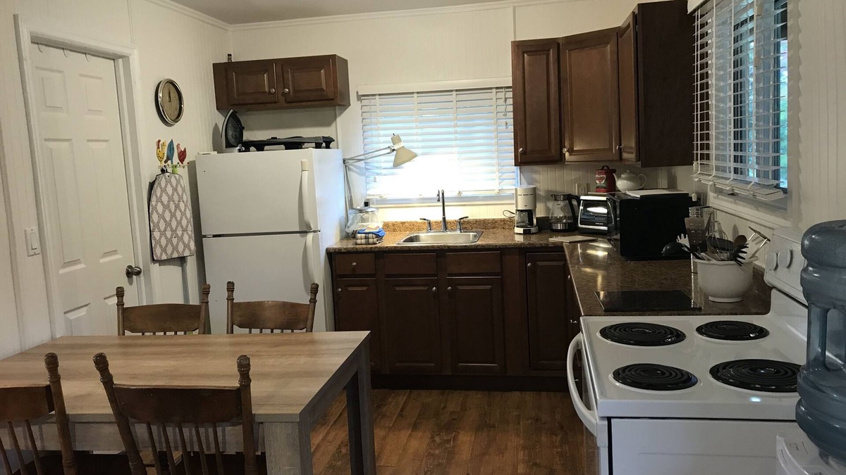 Milford Cottage | Nature Lover's Cottage Retreat On The Black River With Private Dock.