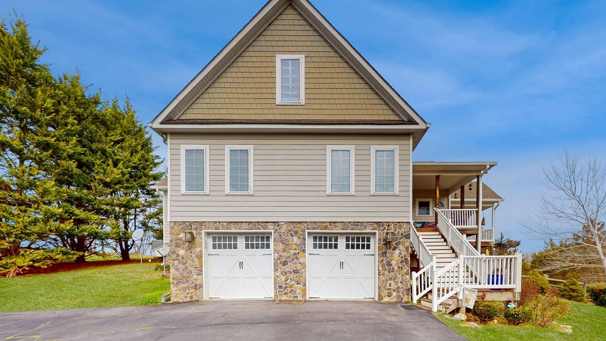 Livingston House | Nature lover’s lakefront home with a beach, dock, fire ring, & more