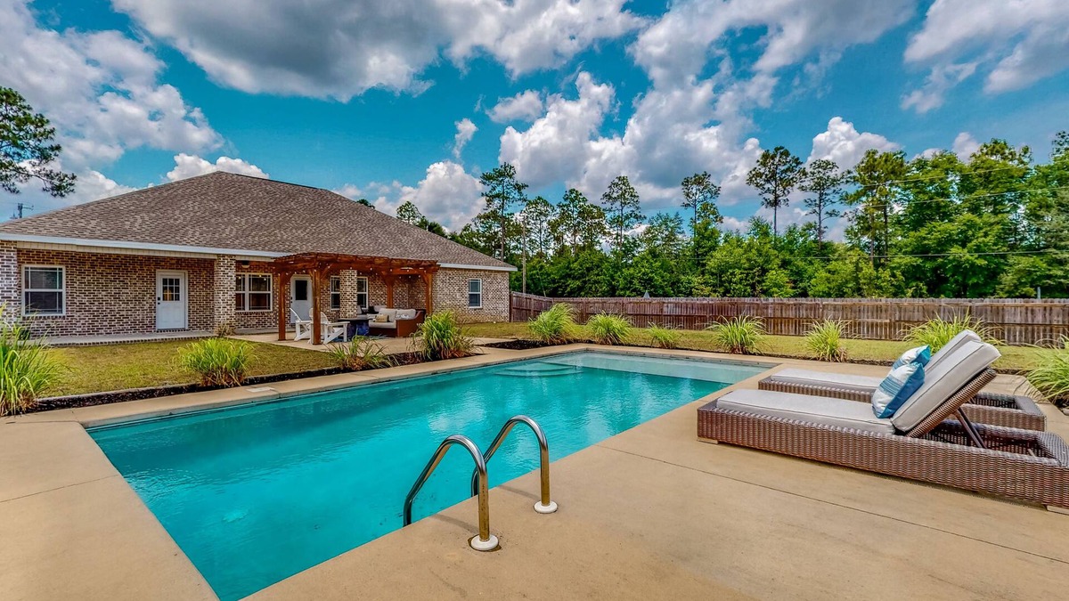Crestview House | Nautical-themed retreat with a saltwater pool, fire table, full kitchen, and AC