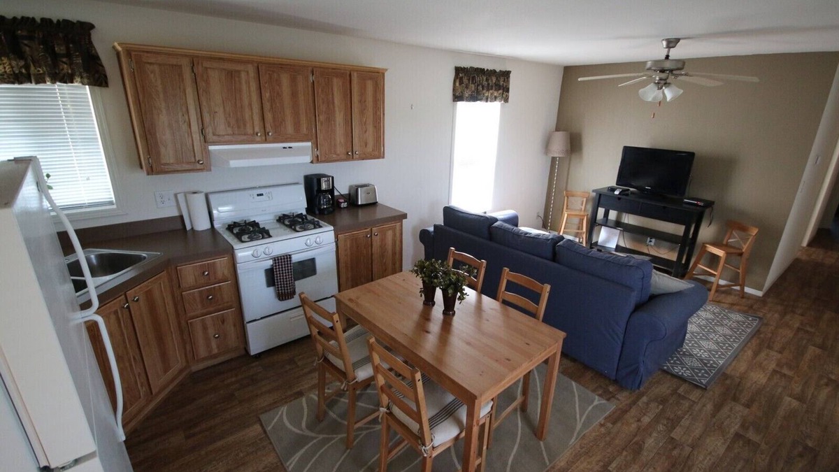 Gallatin Cabin | Nestled in nature, the cabin resides near a tranquil pond, perfect for fishing