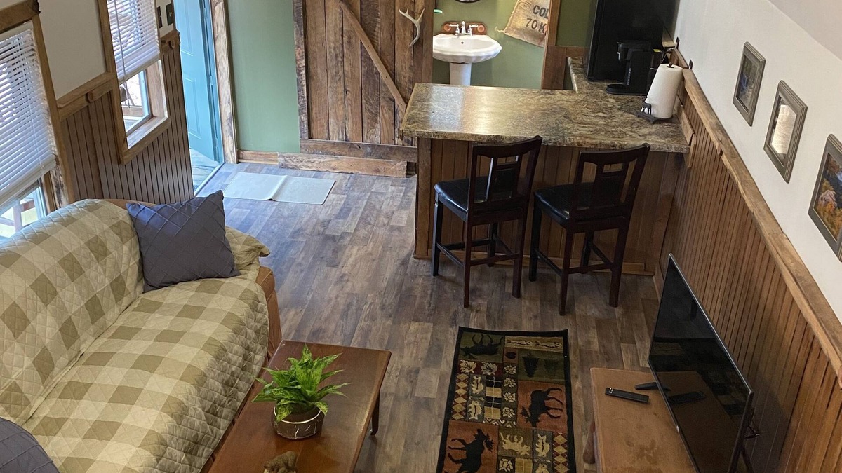 Gray Hawk Cabin | Nestled in woods a stone's throw from Daniel Boone Forest and 600 mi of trails .
