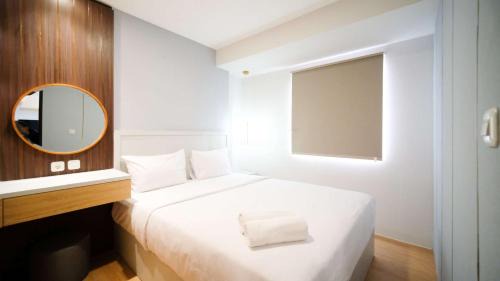 Sidoarjo Apartment | New and Homey 2BR Apartment at Suncity Residence By Travelio