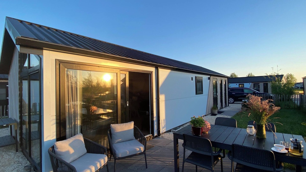 Municipality of Kampen House | NEW Elegant waterfront chalet with jetty Lake Kampen Netherlands vacation home boat