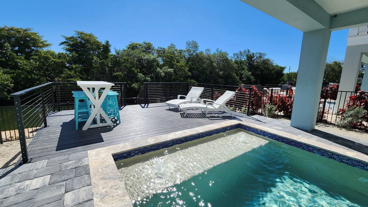 Cortez House | NEW! Saltwater Serenity .08 Miles to AMI, Canal Front w/Heated Pool!