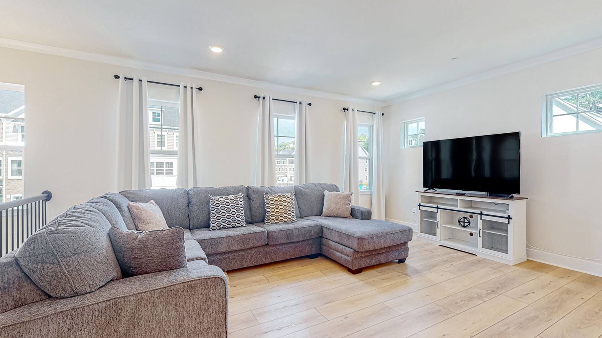 Ocean City House | Newly built row-end townhome with water view, pool access, patio, & balcony