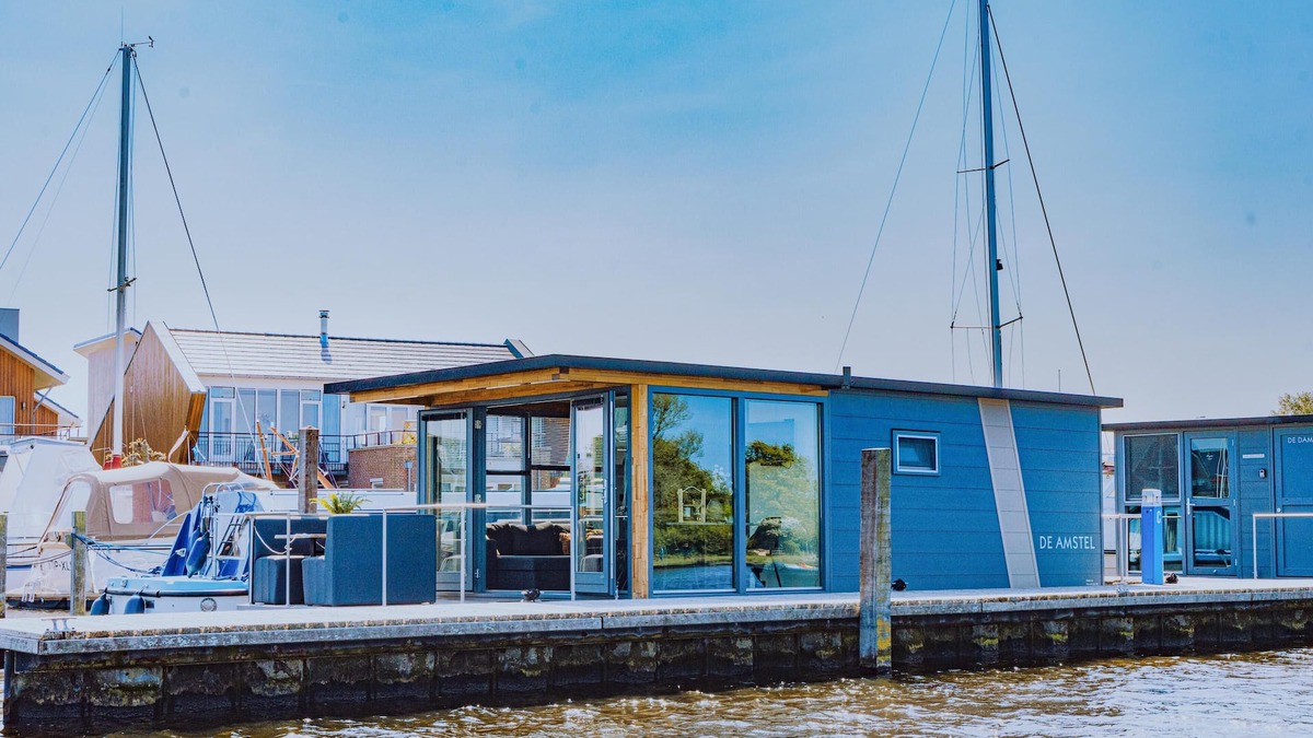 Municipality of Uitgeest Boat Rental | Nice houseboat with waterfront terrace