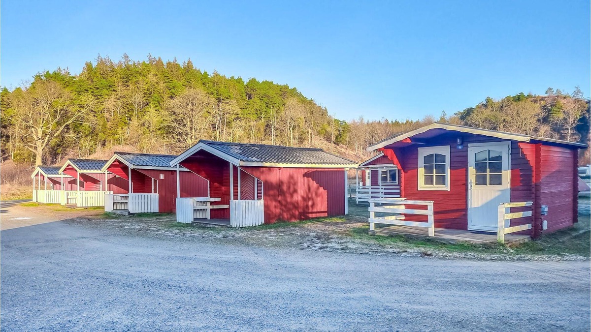 Stromstad O House | Nice small wooden cottage on natural plot by the sea fjord.