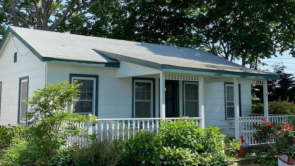 Town of Southold Town House | North Fork water-view Cottage in coveted beach hamlet New Suffolk.