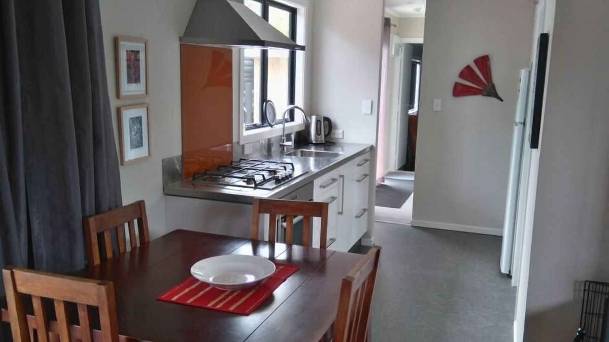 Waitarere Beach House | Now with unlimited fibre broadband! Warm,2 bedroom bach in quiet,sunny location.