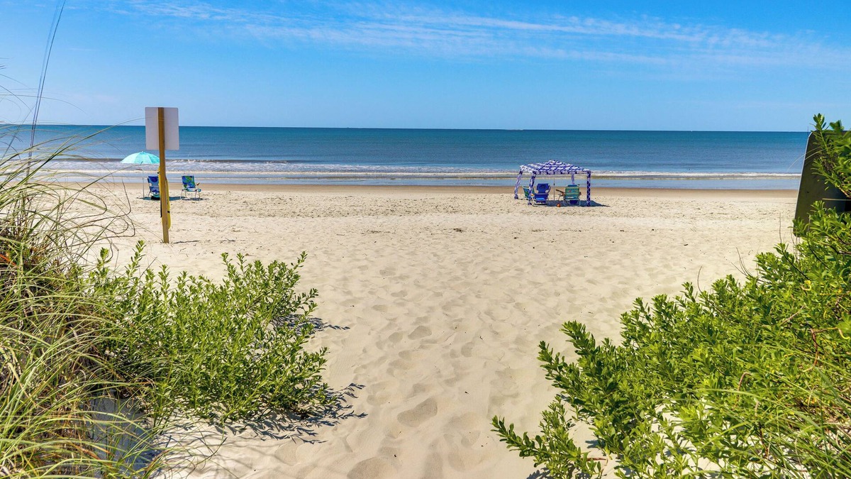 Yaupon Beach Apartment | Oak Island Condo w/Ocean View: Steps to Beach!