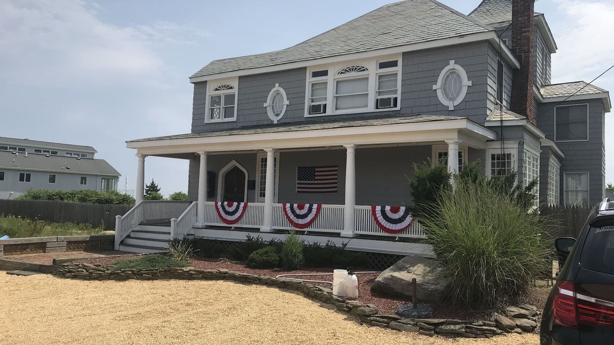Long Branch House | Ocean Front Beauty with Private Beach, Grass Yard, Beach Volleyball and. More!