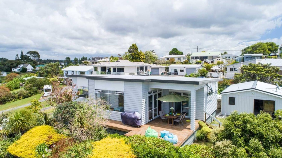 Mangawhai Heads House | Ocean Views - Modern, sunny, pet friendly holiday home only a short walk from the estuary