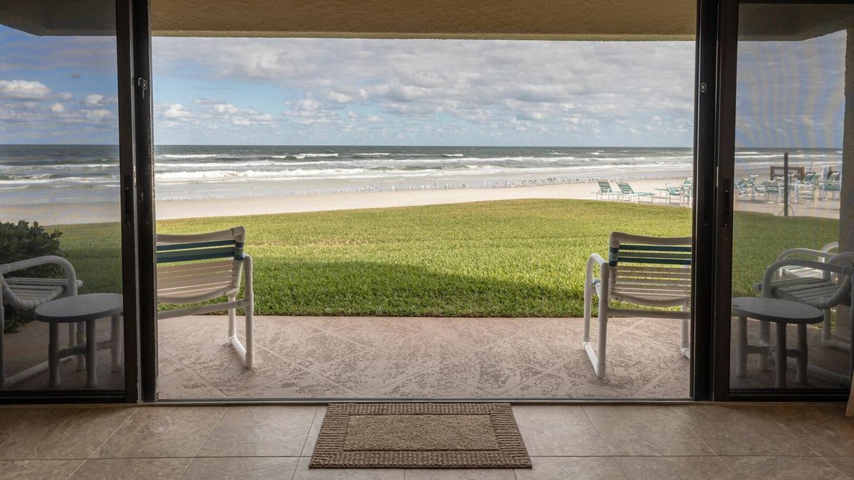 New Smyrna Beach Condo | Oceanfront Ground-Floor Retreat on No-Drive Beach | Peace & Comfort