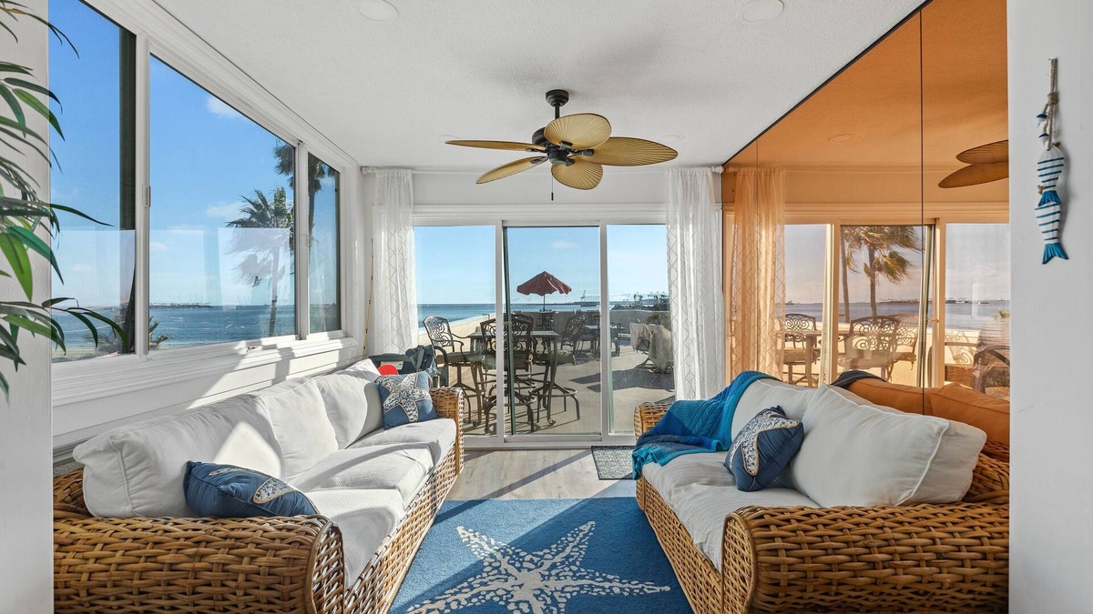 Alamitos Beach House | Oceanfront retreat with rooftop deck, modern interior, marble finishes, & W/D