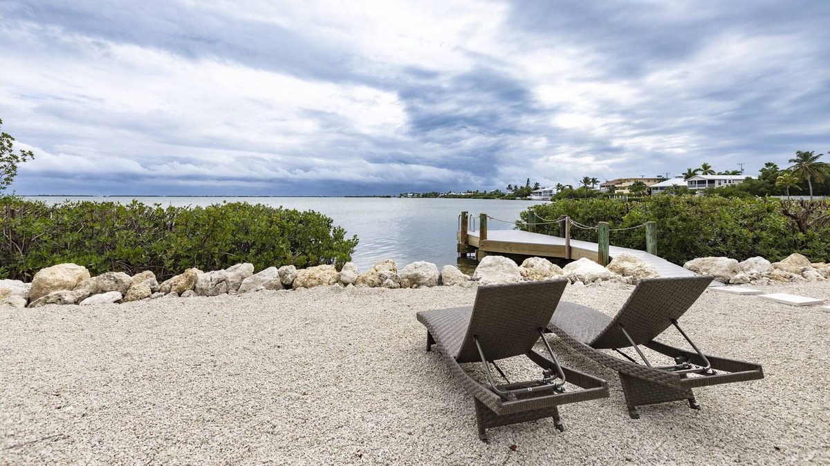 Breezeswept Beach Estates House | Oceanview Cottage: Embrace Island Living with Sandy Toes and Breathtaking Open Water Views!
