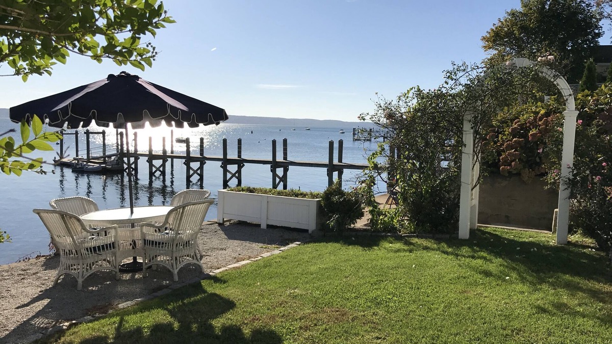 Bristol Cottage | Old fashioned designer front porch living by the sea with expansive water views.