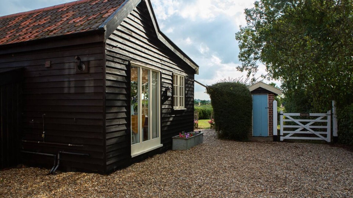 Alburgh House | One bedroom barn with open plan living area, private patio/garden,great sunsets