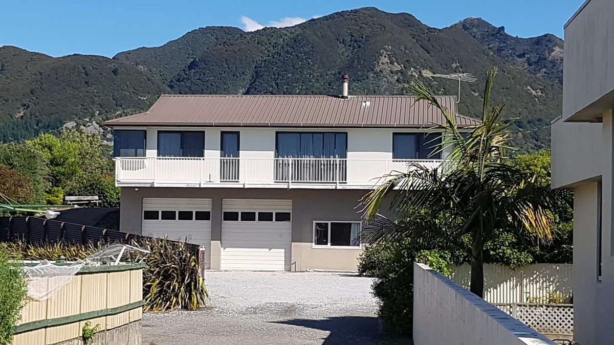 Pohara House | Only steps from the beach. Roomy, relaxed family fun. Good old Kiwi bach.