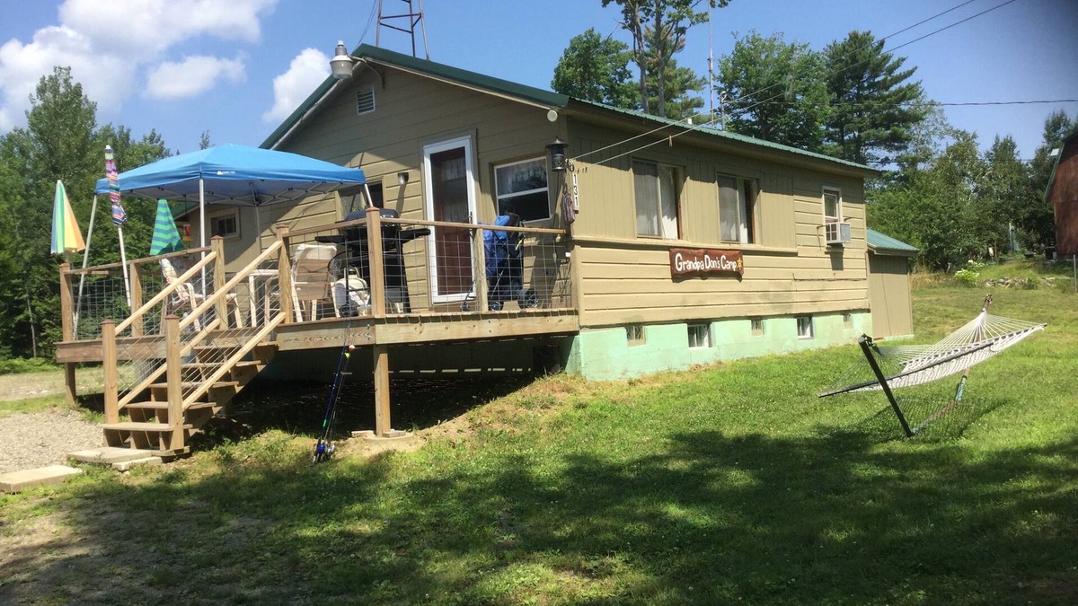 North New Portland Cottage | Paddle, float, fish, or rope swing into the near by crystal clear mountain lake.