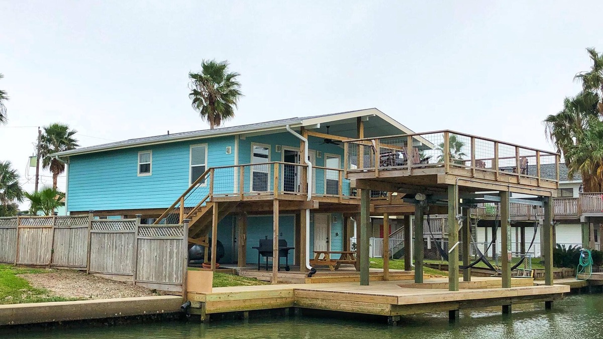 Jamaica Beach House | Palm Breeze Canal Home with Kayaks & Bicycles - Sleeps 6 STR25-000199