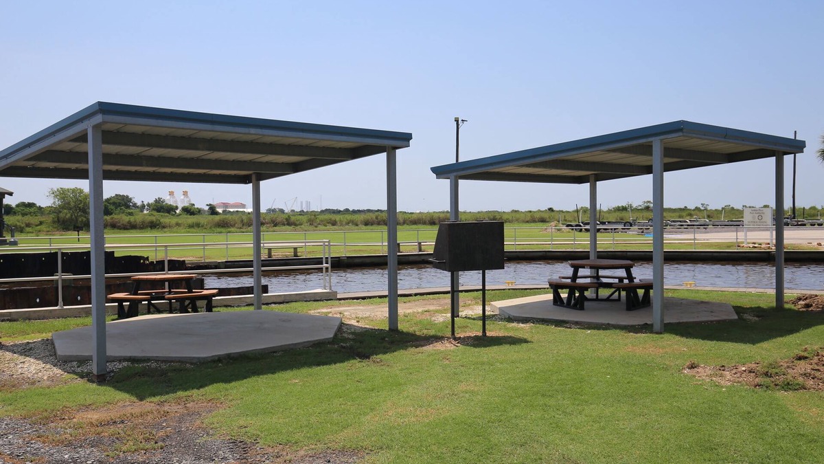 Sabine Pass Cottage | Park your boat in front of the Fishermen's Cottage! Screened in patio.