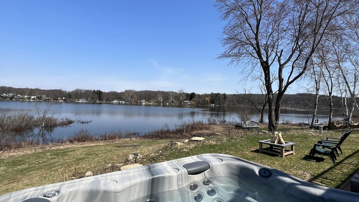 Delton House | Peaceful & Private Lakefront House on Shelp Lake, hot tub is open year round