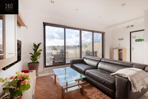 Tal-Ghoqod Apartment | Penthouse and BBQ Kitchen Island & Massive living by 360 Estates