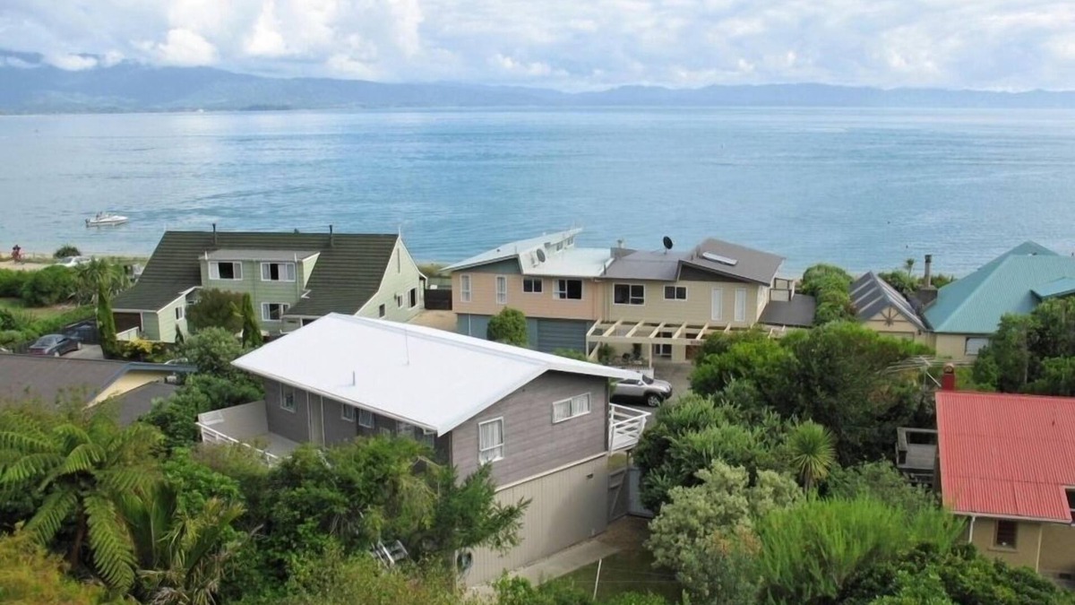 Tata Beach House | Pet friendly yard, great Sea Views and just across the road from Tata Beach