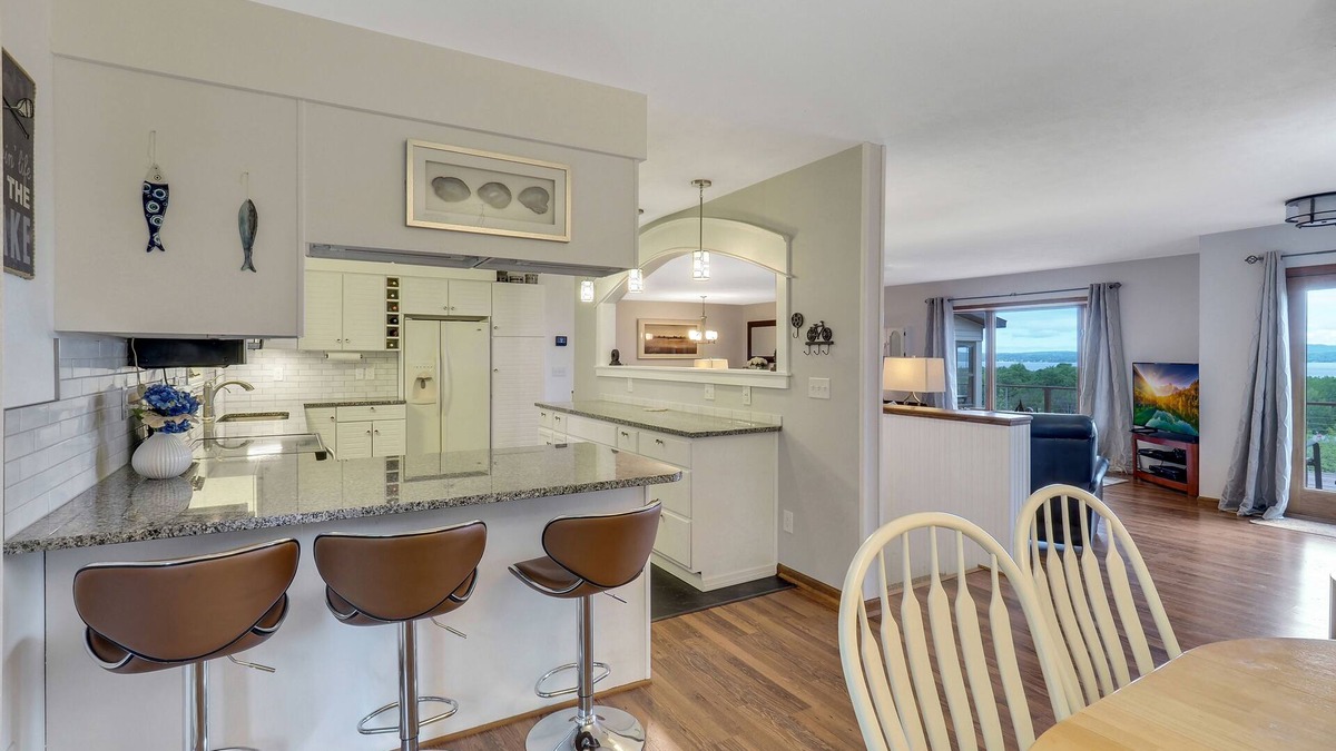 Petoskey House | Petoskey Home with Little Traverse Bay Views | Sleeps 8 | Wrap Around Deck