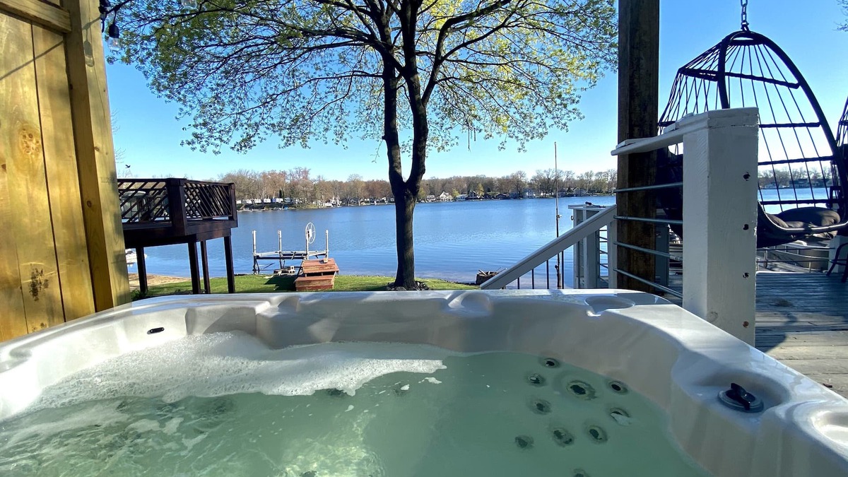 Plainwell House | Pine Lake Retreat- sparkling hot tub! Lakeside house with sandy beach lakefront!