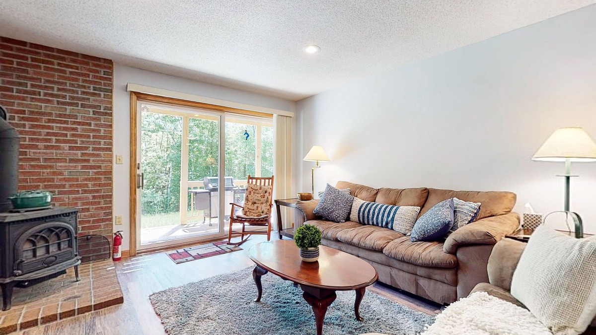 North Conway Condo | Pleasant dog-friendly condo with wood stove, gas grill, pool, & kitchen
