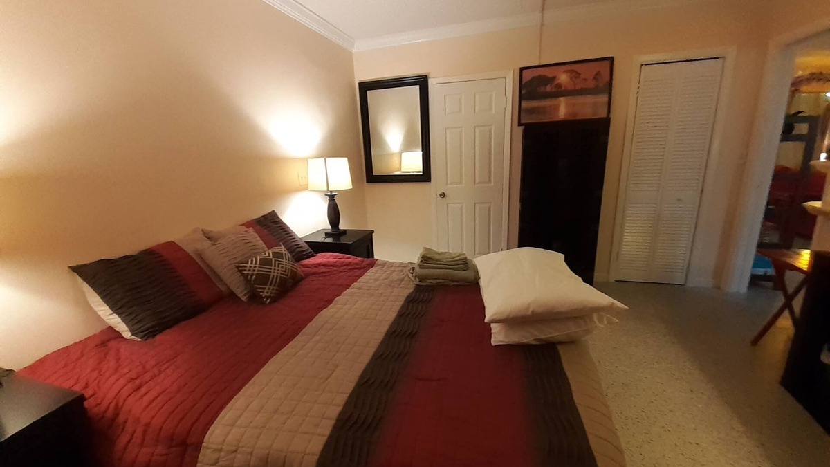 Lake Worth Corridor House | Plumaria Room with private bathroom on shared lakeview House