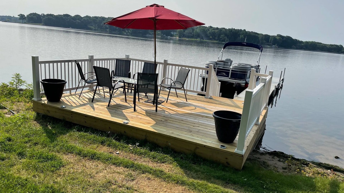 Norton Shores House | PONTOON BOAT NOW INCLUDED! KAYAKS! Waterfront Cottage on Mona Lake with HOT TUB!