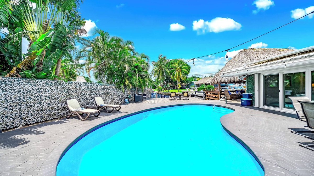 Coral Ridge Isles House | Pool! Waterfront+Tiki Hut Bar! Golf Cart Included!
