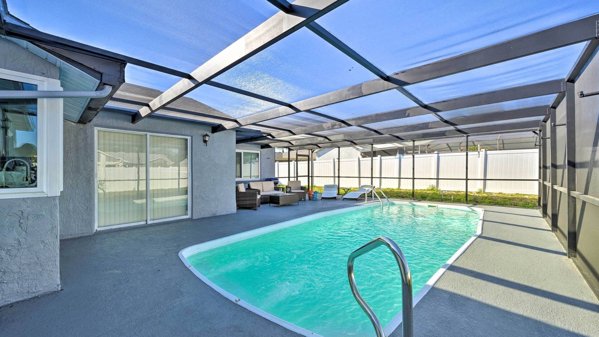 Orchid Lake Village House | Port Richey Getaway w/Lanai, Pool & Grill!