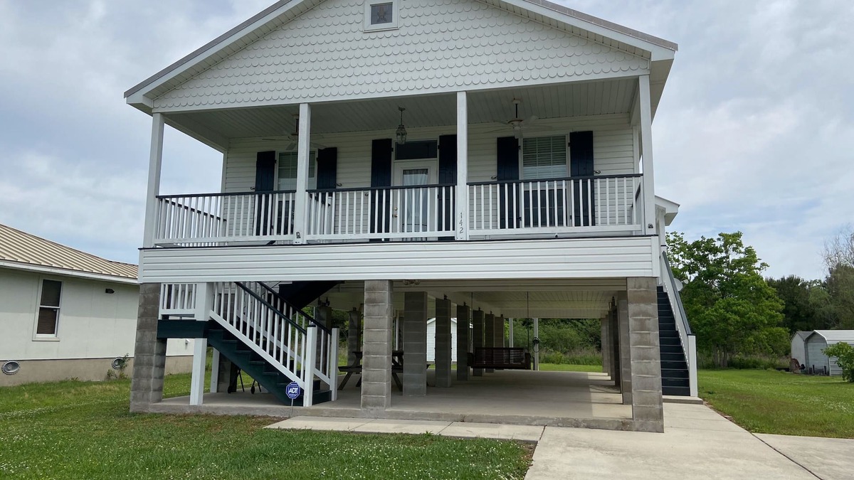 Waveland House | Pretty raised three bedroom beach home awaits you! A short 3 min. walk to beach!