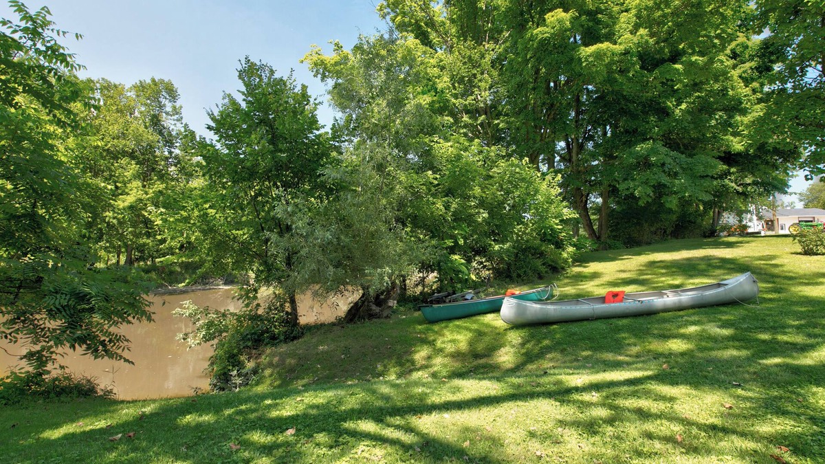 Croswell House | Private access Riverbend Retreat, fishing, canoes, wildlife, & swinging bridge