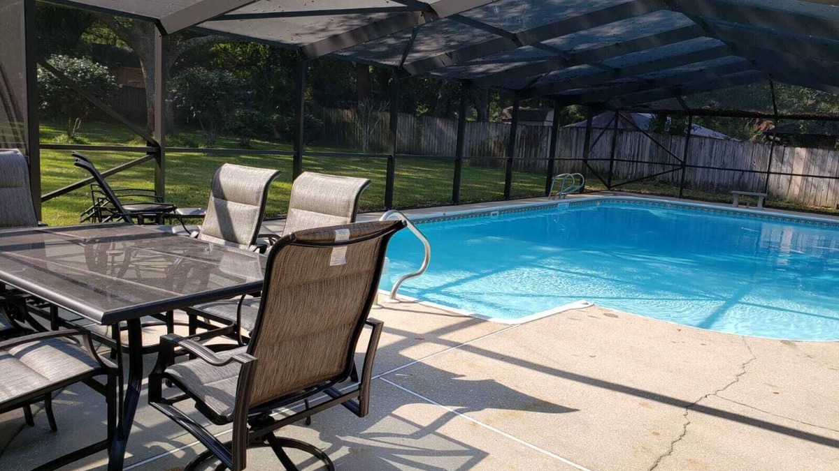 North Northwest Pensacola House | Private Getaway with Screened Pool, Upscale Kitchen, & Large Private Fenced Yard