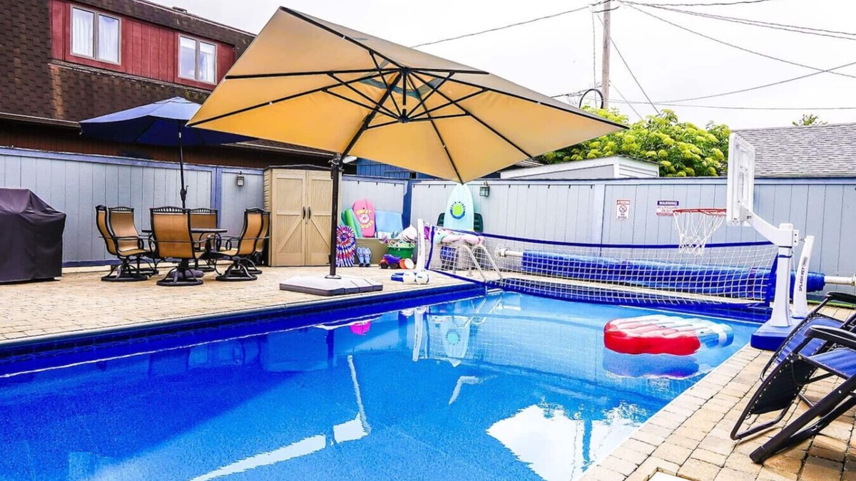 Huron House | Private heated pool in back & Sandy beach in front
