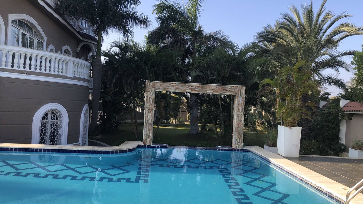 Al-'Amriyah Condo | Private resort type condo setting with full access to garden and pool