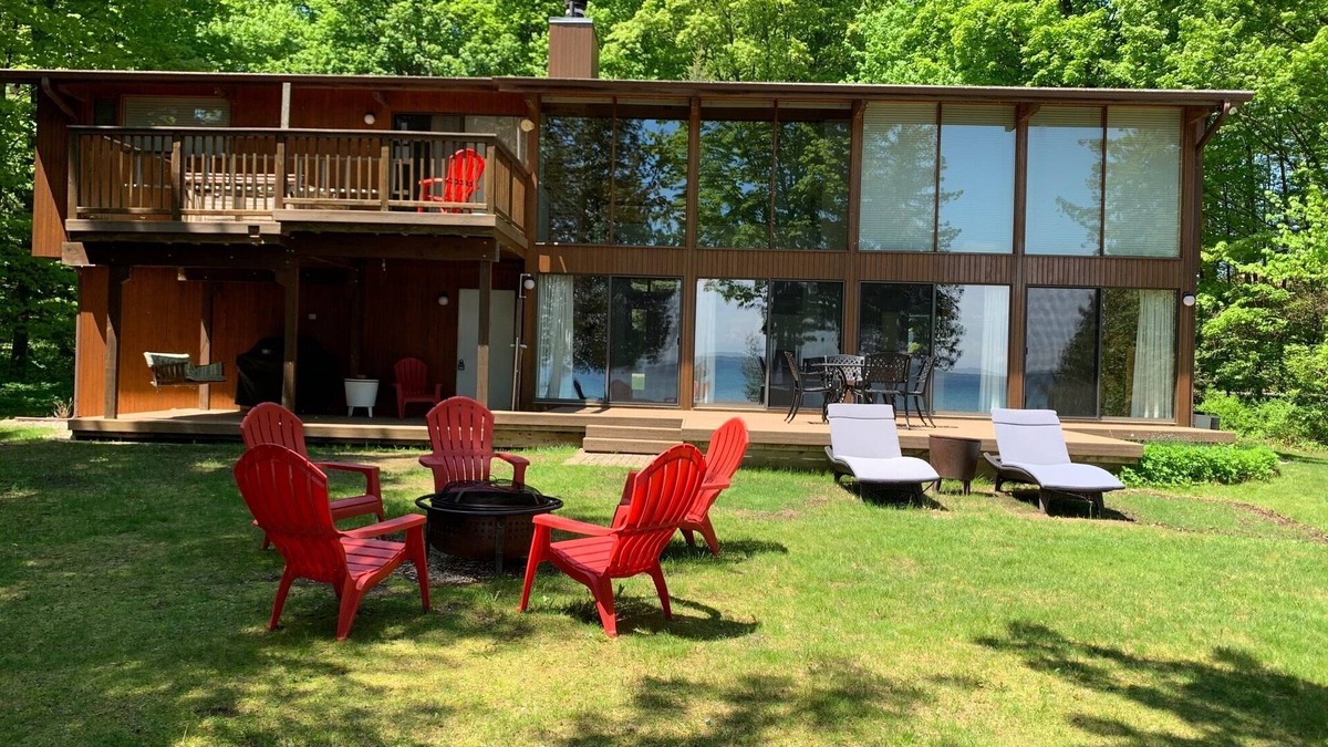 Suttons Bay House | Private Suttons Bay Waterfront Home with Hot Tub, Sauna and Central Air!