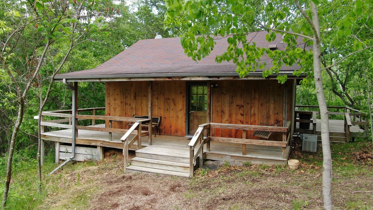 Norwalk Cabin | Quaint cabin overlooking the creek below and wetlands in the valley basin.